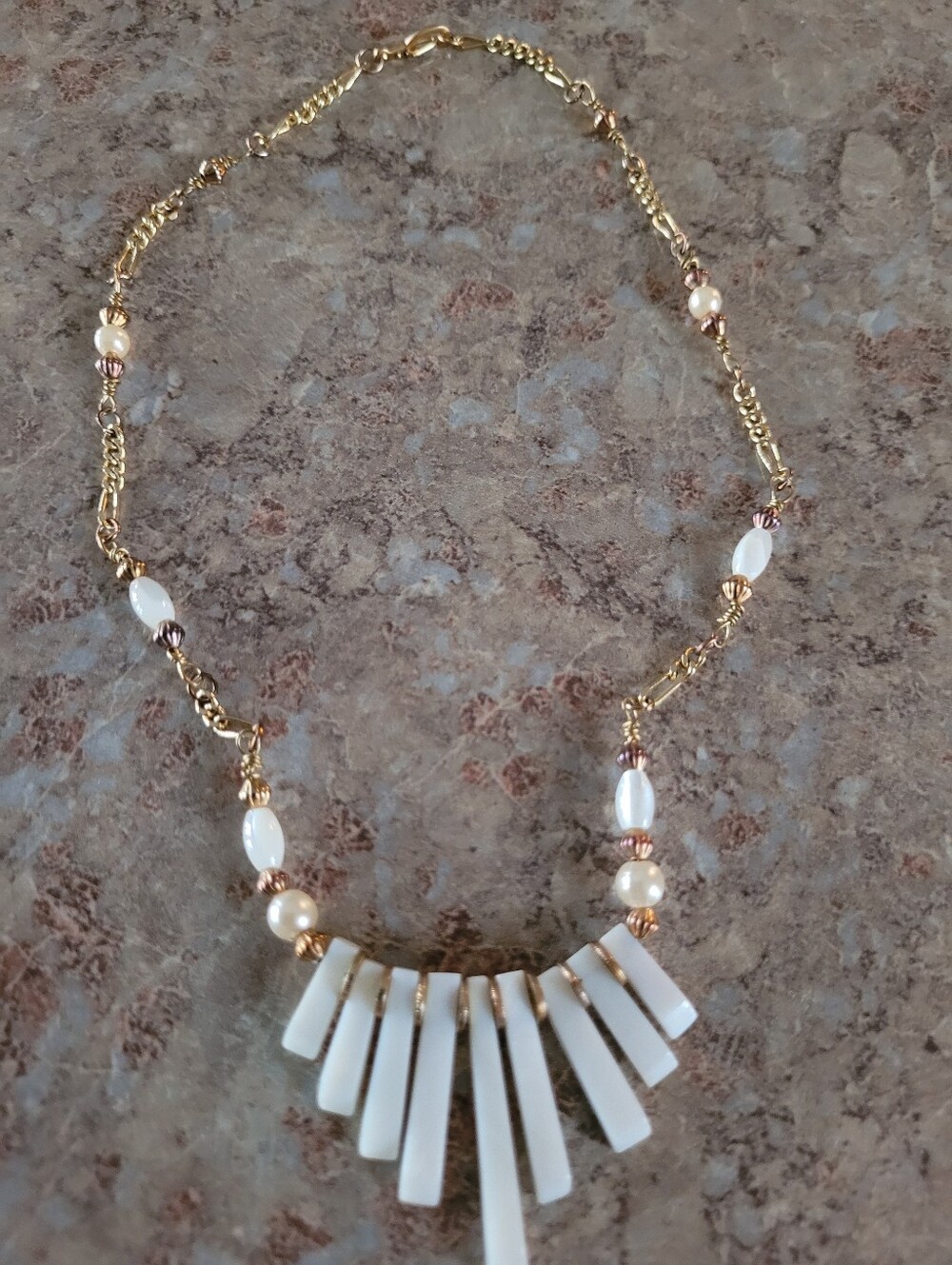 Gold Tone Chain Necklace with White Charm.